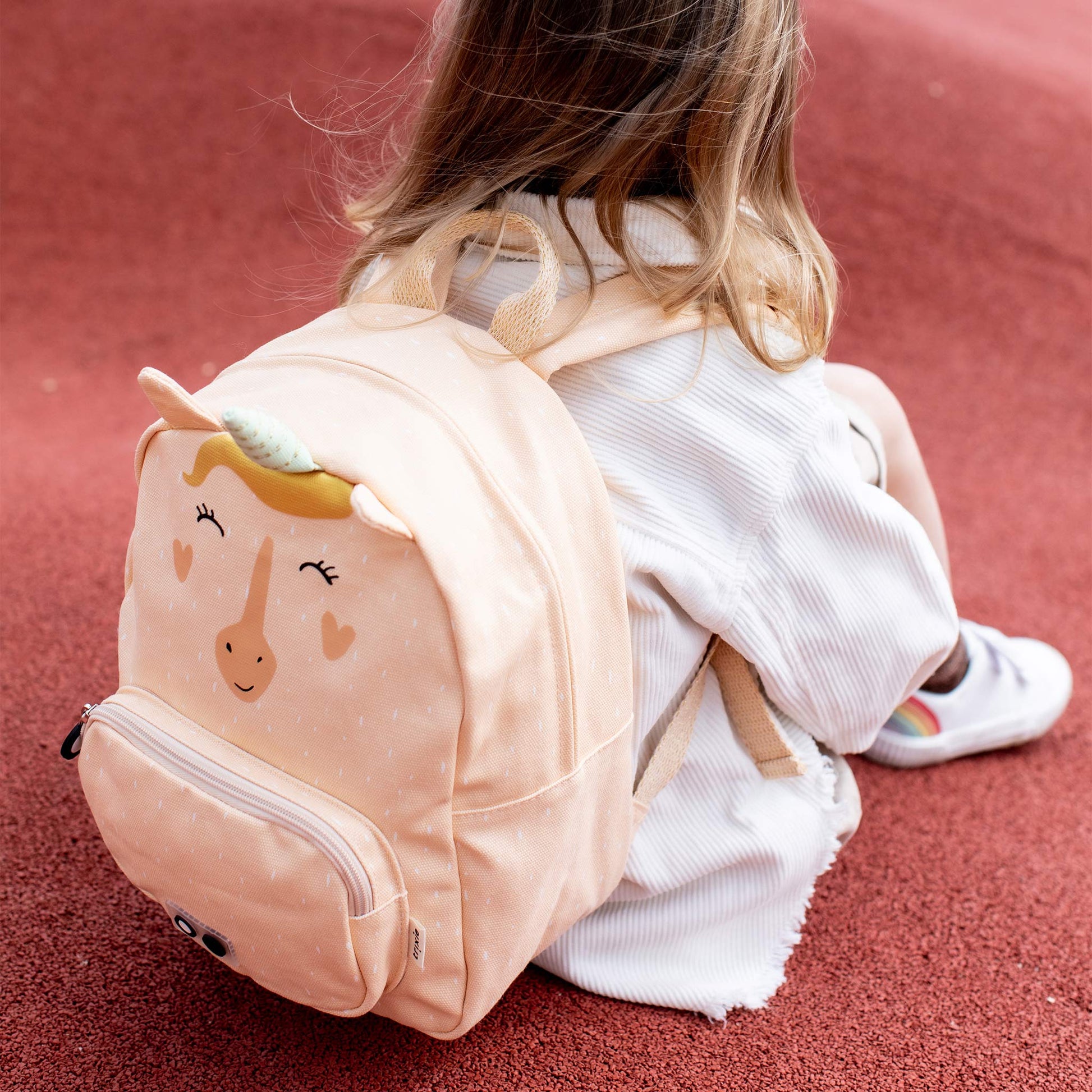 Little girl wearing the Trixie Backpack - Mrs. Unicorn 