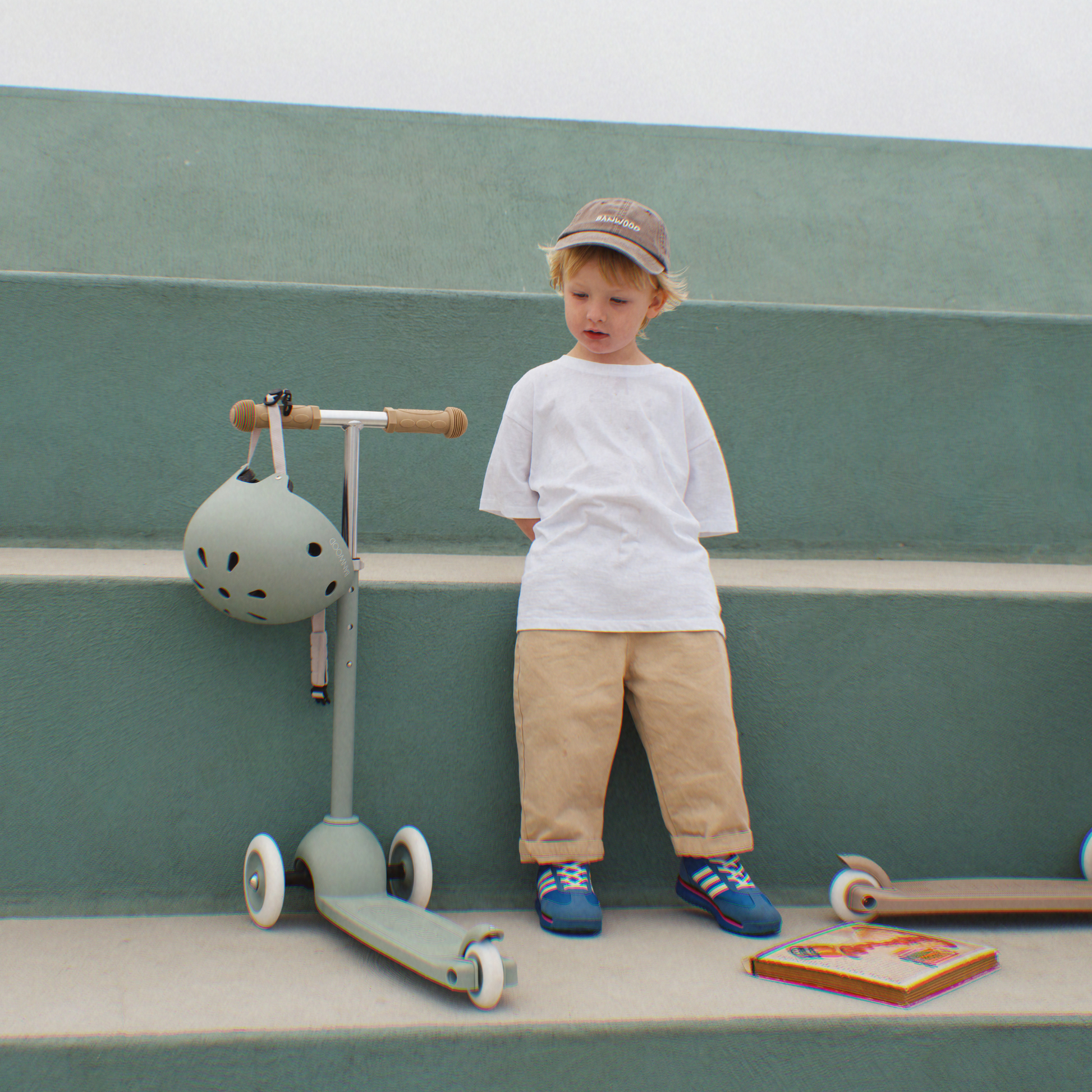 Child with Banwood Eco Helmet and Scooter in Clay