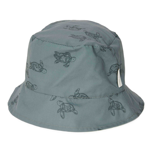 Little Boy Wearing The Little Dutch - Reversible Bucket Hat In Turtle Island Print