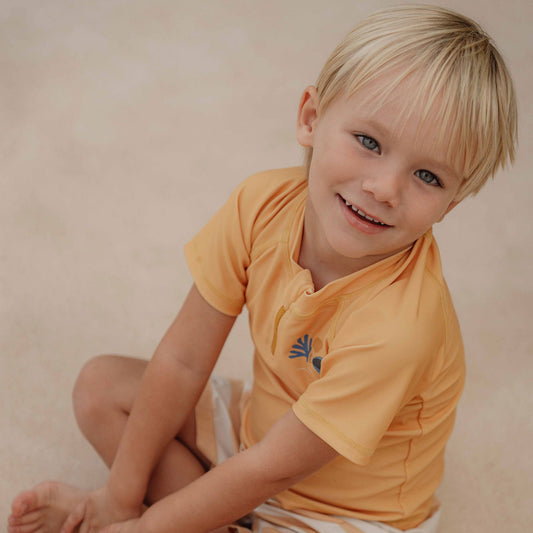 Little Dutch Boy Wearing The Little Dutch Swim T-shirt short with short sleeves In Honey Yellow