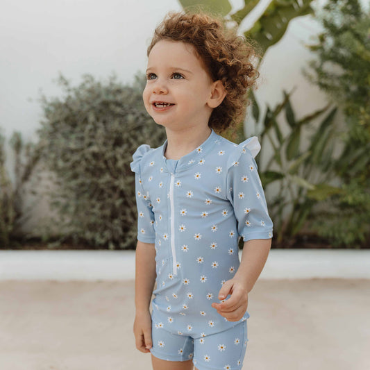 Little Girl wearing the Little Dutch - Short-Sleeve Ruffles Swimsuit In Daisies Blue