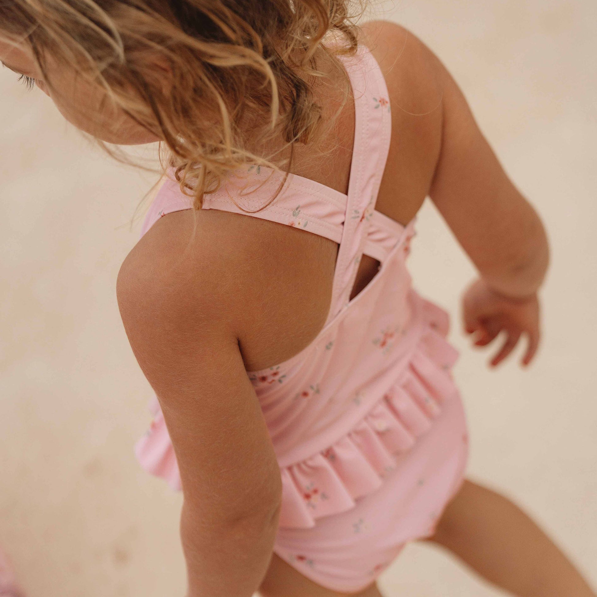 crossover back and frill detail of the Little Dutch Rosy Meadows Swimming Costume