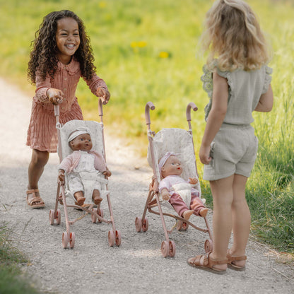 Little Girls Playing With The Little Dutch Metal Doll Stroller And Baby Dolls