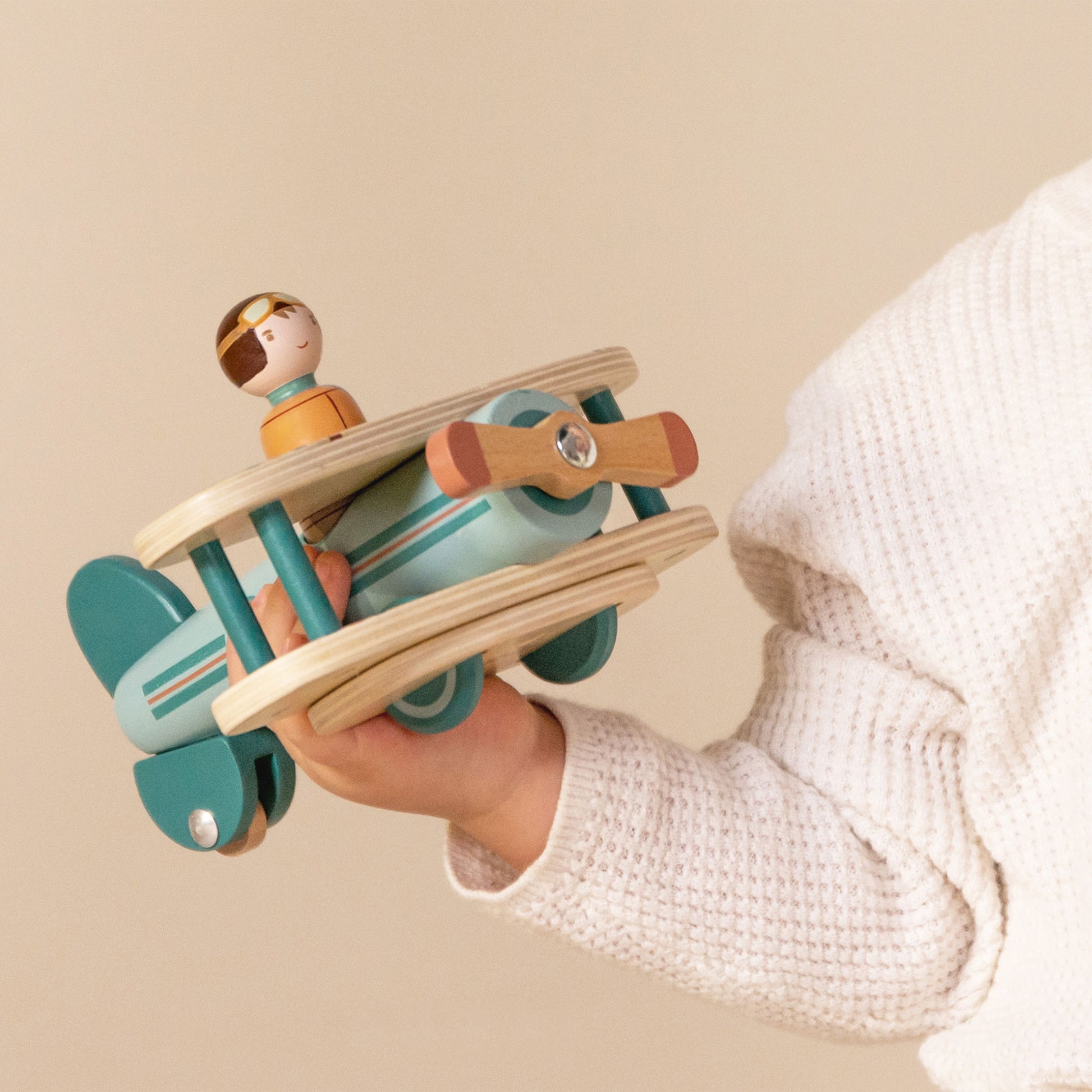 Little Dutch Toy Aeroplane in little boys hand