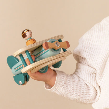 Little Dutch Toy Aeroplane in little boys hand