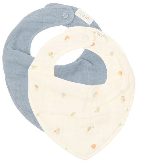 Two bibs, one cream-coloured with autumnal elements, one with a denim-blue colour, both on a white background