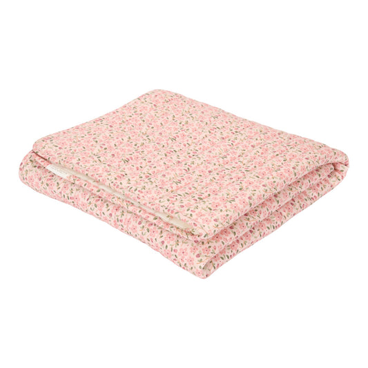 Folded bassinet blanket with a range of pink and red flowers with green leaves