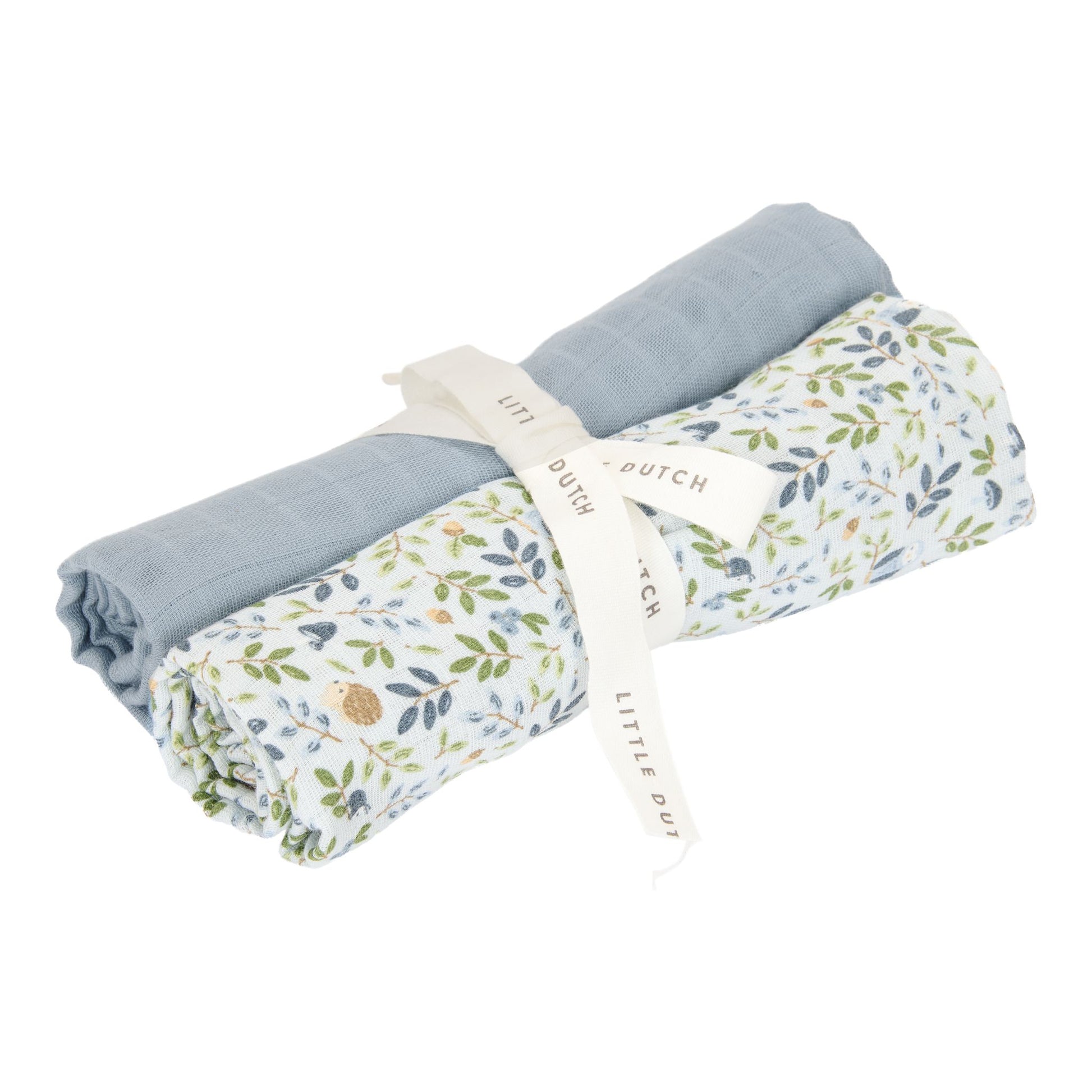 Two muslin cloths tied with a ribbon, one coloured denim blue, one decorated with nature images 