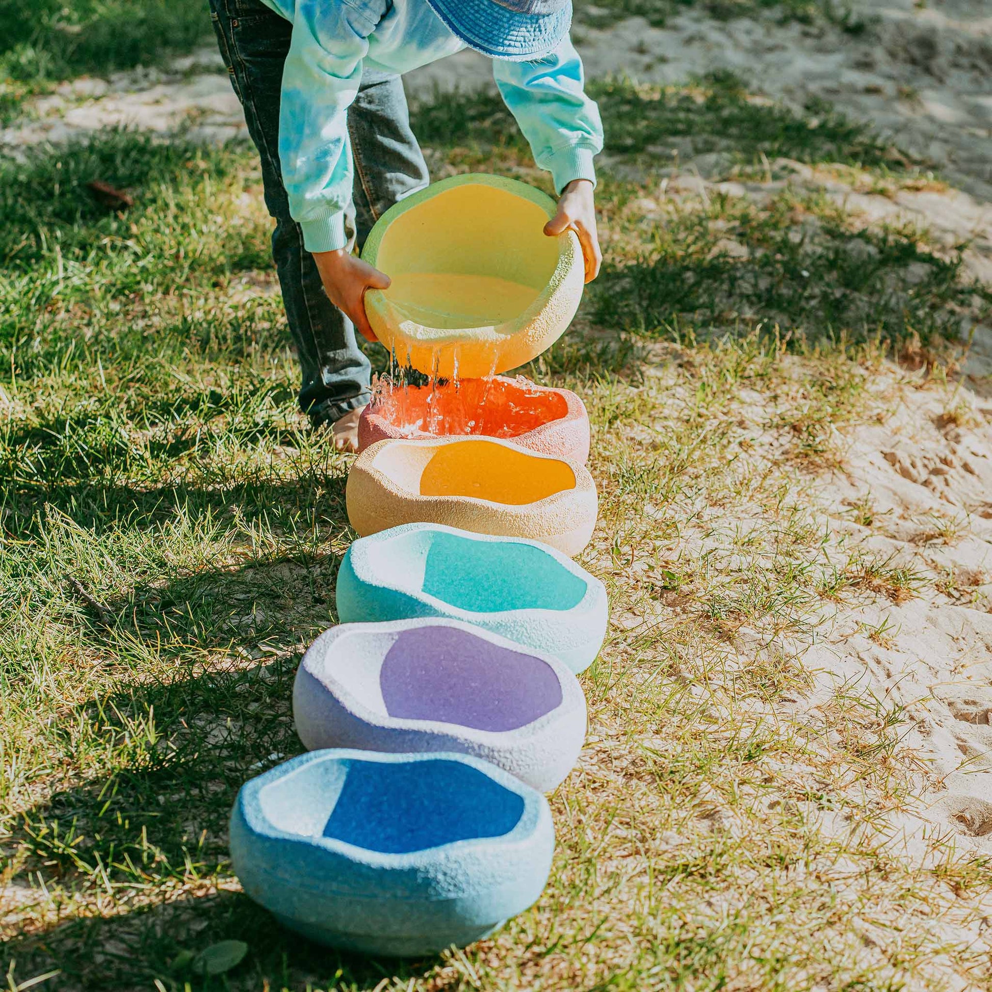 Child Pouring Water Into The Stapelstein Stepping Stones - Pastel Set Of 6 