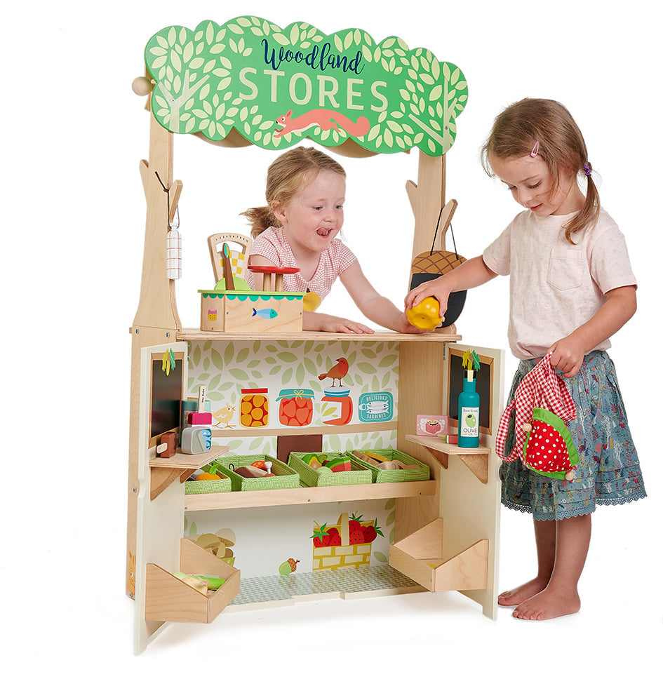 child playing with toy shop