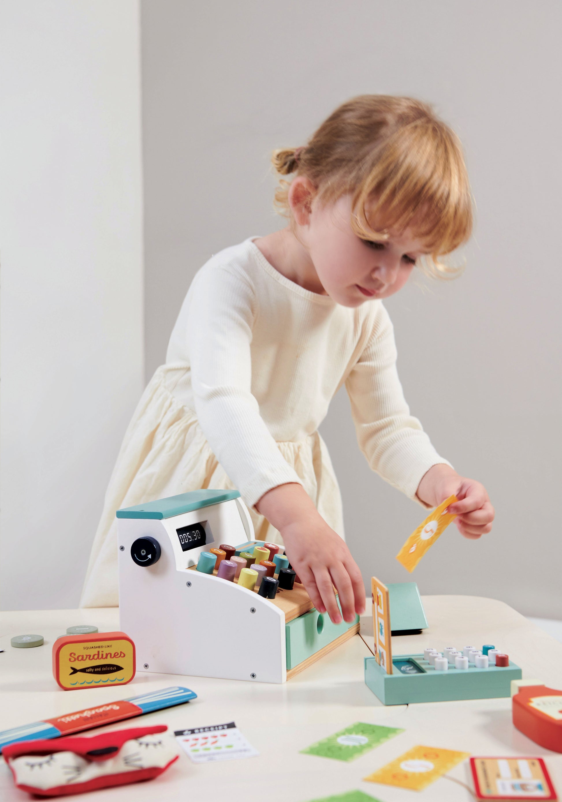 child playing with till