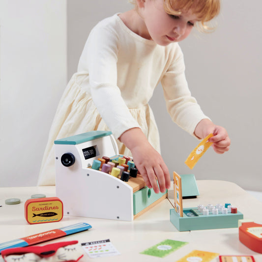 child playing with till