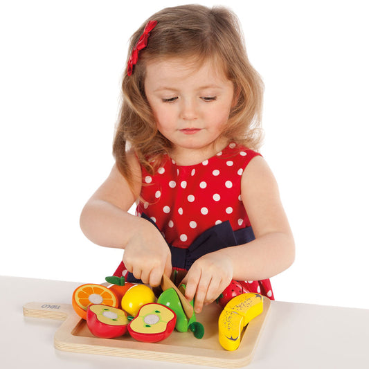 Little Girl Playing With Tidlo Cutting Fruits Set 